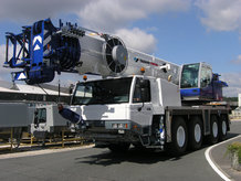 Double hose reel with spring drive on an all terrain mobile crane